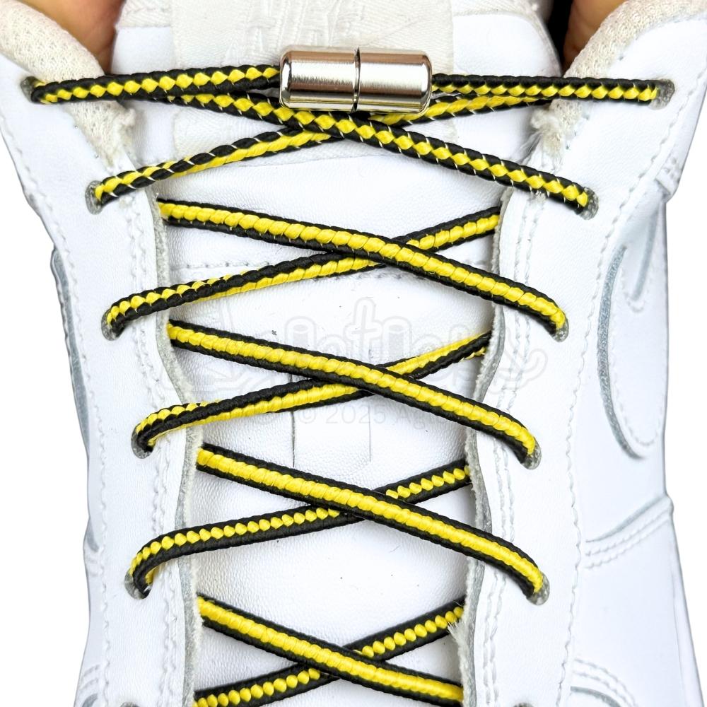 Elastische veters zonder strikken driehoek 3mm capsule sluiting zwart geel met stretch uitgerekt