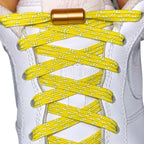 Elastische veters zonder strikken reflecterend 7mm capsule sluiting geel met stretch uitgerekt